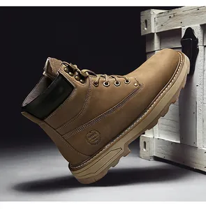 Detail of premium brown leather work boot featuring metal eyelets and textured rubber sole