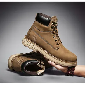 Detail view of tan leather work boots with padded collar and durable rubber sole