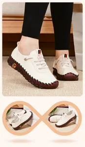 Dettaglio di scarpe casual da donna bianco crema con suola spessa e cuciture rifinite