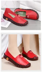 Detailed close-up of red slip-on loafers with non-slip rubber soles for women's comfort