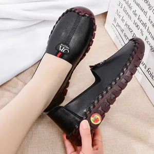 Women black leather loafers with soft thick rubber sole and slip-on casual design