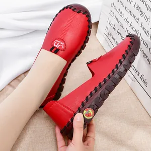 Red leather flats for women with soft rubber soles and vintage handmade stitching details