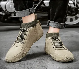 Detail of khaki suede boots with elastic knit collar and quick-lace bungee system