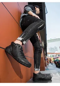 Side view of black high-top leather casual shoes with wavy non-slip sole and street style