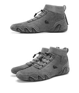 Detail view of grey suede high-top boots with knit collar and wave-patterned rubber soles