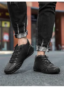 Close-up of black casual leather shoes with wave stitching and cross lace-up detail