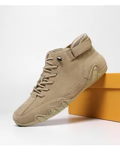 Macro shot of khaki high-top casual shoes with suede texture and velcro ankle strap