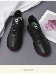 Detail of lychee pattern leather shoe with contrast stitching and soft rubber sole