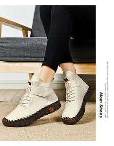 Detail of beige fleece-lined warm casual boots with hand-stitched leather upper