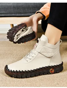 Close-up showing the flexible rubber sole and soft leather of these warm winter ankle boots
