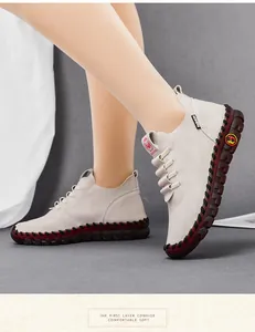 Detail of hand-stitched cream cowhide leather shoes with soft rubber soles and comfort design