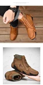 Detail of men's brown leather high-top boots with knit collar and embossed logo