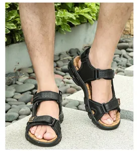 Outdoor male leather sandal with thick anti-slip sole and brown textured footbed