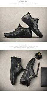 Detailansicht schwarzer Leder-Freizeitschuhe mit goldener Sport-Stickerei und Gummisohle