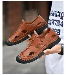 Detailed view of handmade stitching and premium brown leather texture on men's beach sandals