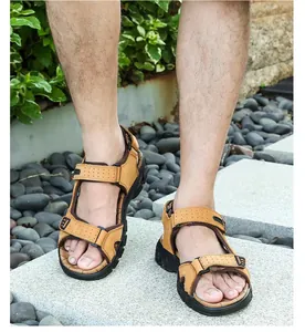 Outdoor shot of men's leather beach sandals with adjustable triple straps and thick soles