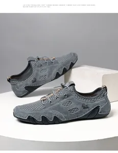 Détail de baskets en mesh gris pour hommes avec daim respirant et système de lacets