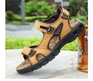 Detail of brown leather men's sandal with adjustable straps and textured non-slip sole