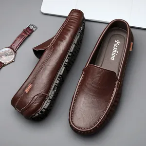 Dunkelbraune Leder-Slipper für Herren mit Noppengummisohle und orangem Detail