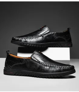 Macro shot of black genuine leather loafers showing soft sole and fine hand stitching details