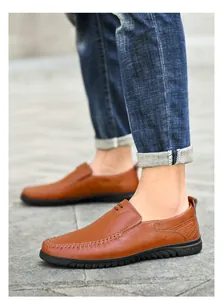 Detail showing high-quality brown leather upper with contrast stitching and soft sole
