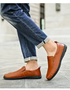 Detail of brown leather loafer featuring contrast stitching and durable soft rubber sole