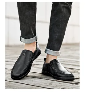 Detail of men's genuine leather loafers with U-shaped stitching and anti-slip sole