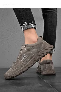 Vista laterale di sneakers marroni da uomo con scritta FREEDOM e suola spessa antiscivolo