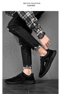 Dettaglio delle sneakers casual in camoscio nero con scritta Freedom bianca sul lato