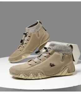 Detail of khaki suede boots with grey knitted collar and elastic drawstring laces