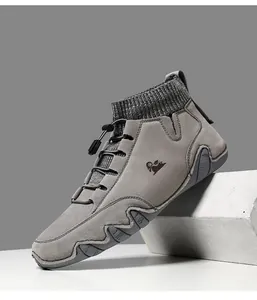 Detail view of grey suede casual shoe with knit sock collar and elastic drawstring laces