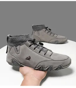 Detail of grey suede hiking boot with knitted collar and adjustable elastic drawcord