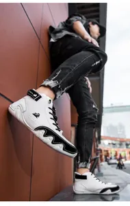 Detail of high-top sneakers with white and black wave pattern and LDECK velcro strap