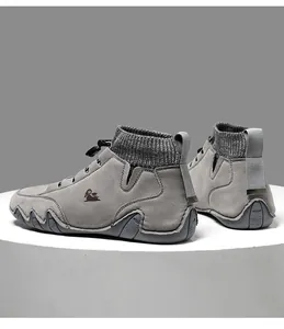 Detail of grey knitted sock collar and suede leisure boots with toggle lacing system
