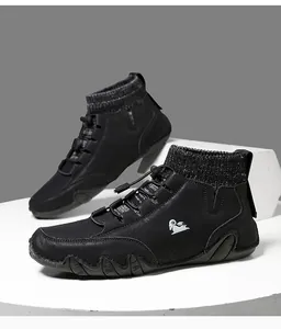 Detail of black high-top sock sneakers with leather texture and drawstring toggle closure