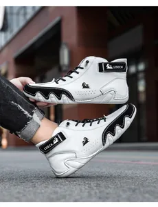 Detail of LDECK high-top sneakers with white leather, black trim, and wavy textured soles