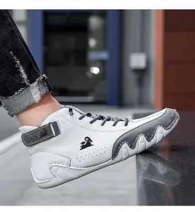Detail view of white and grey leather shoes with LDECK logo and wave anti-slip sole