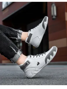 Close-up of high-top sneaker with wavy outsole, leather panels and velcro ankle strap