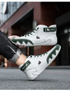 Detail of high-top sneakers in white and green leather with unique wave-textured sole
