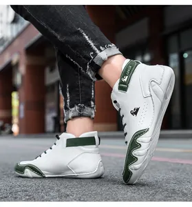 Detail of LDECK high-top leather sneakers with green suede panels and ankle strap