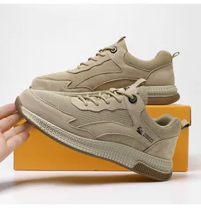Detailed close-up of khaki breathable mesh and suede upper on men's outdoor casual sneakers