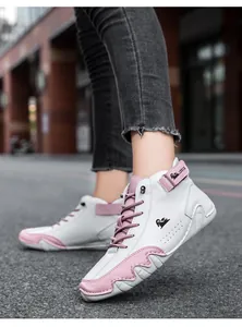 Detail of LDECK high-top sneakers with pink accents and adjustable ankle strap