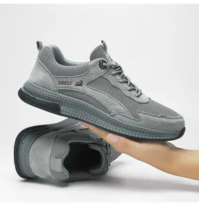 Detail of grey mesh and suede casual sneakers showing breathable fabric and non-slip sole