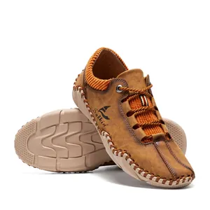 Detail of handmade stitching and orange knit collar on brown leather casual shoes