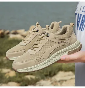 Close-up of khaki leather and mesh panels on outdoor sneakers with rubber sole