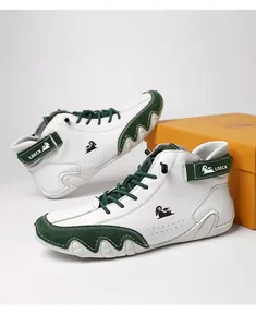 Close-up of green and white color-block high-top boots with wave edge rubber sole