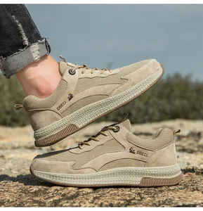 Detail of khaki breathable mesh and leather paneling on men outdoor casual shoes