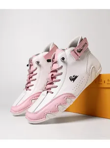 Detail of high-top sneakers in white and pink with wave-textured soles and brand logo
