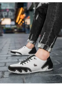 Detail of black and white leather casual shoe with octopus sole and side logo