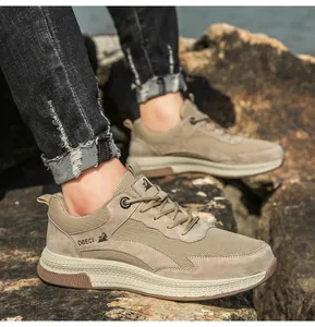 Close-up of breathable mesh and suede leather men's sneakers on rocky outdoor terrain